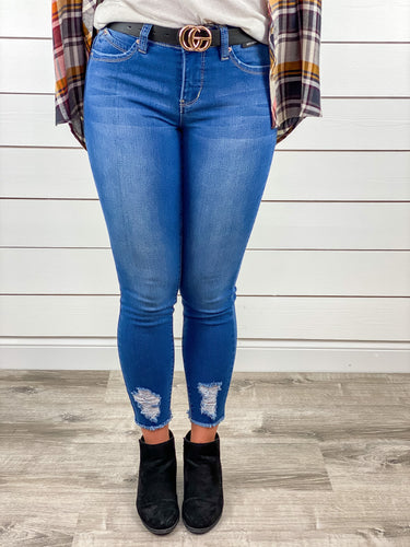 Mid Rise Tattered Hem Frayed Jeans